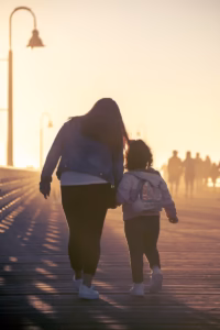 2 women walking on the road during daytime